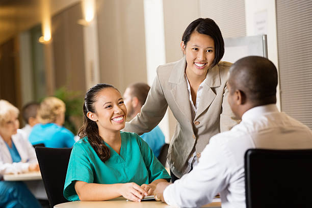hospital administrator interviewing nurse for potential employment